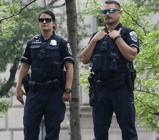 Two professional security guards protecting an apartment complex