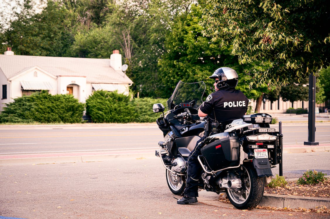 An off-duty police officer on a parked motorcycle 