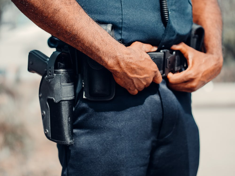 A Uniformed Guard with a handgun