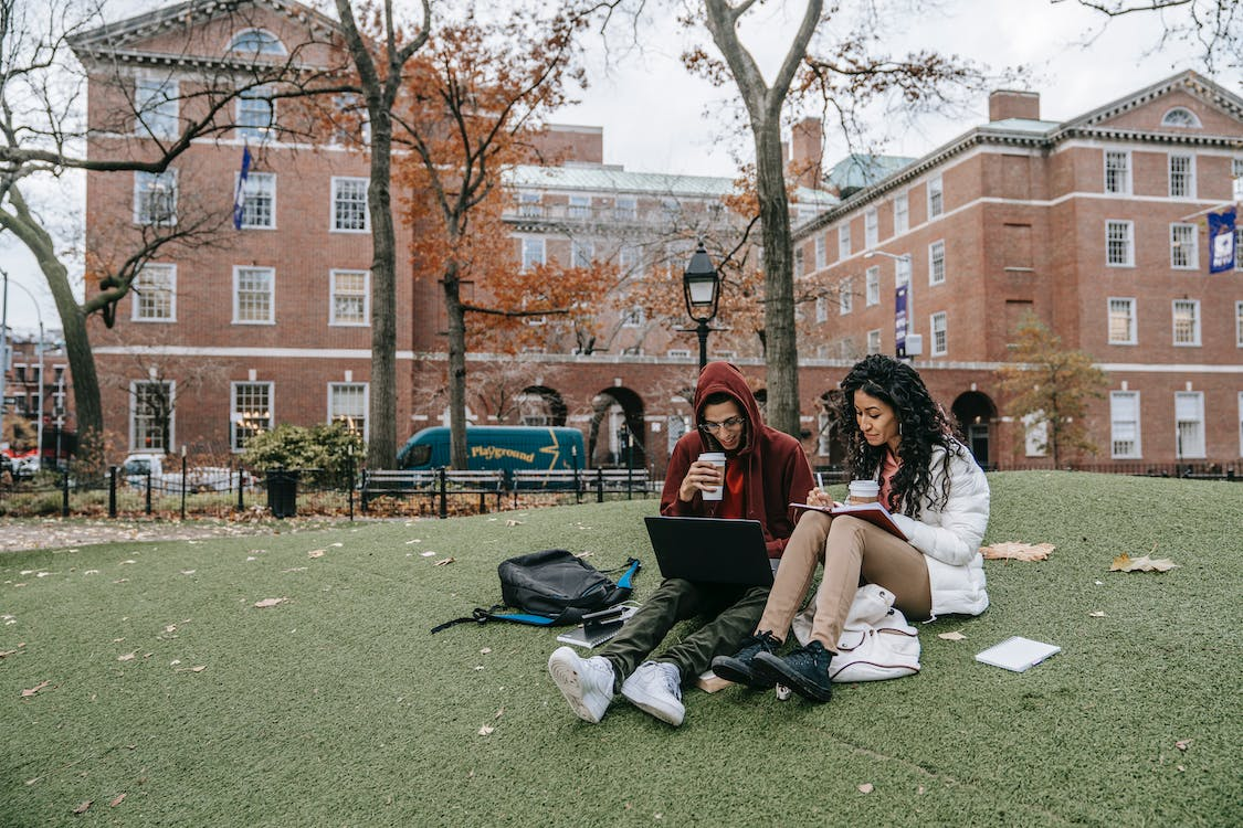 Two students studying on a university campus 