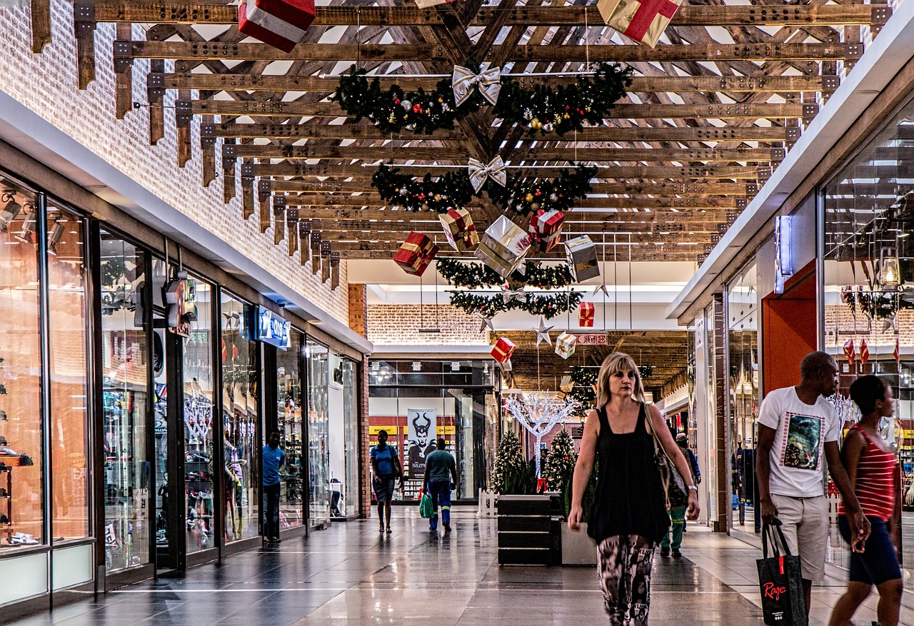 a woman in a crowded mall during the holiday season