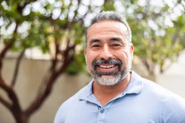 Person casting a vote into a ballot box on Election Day