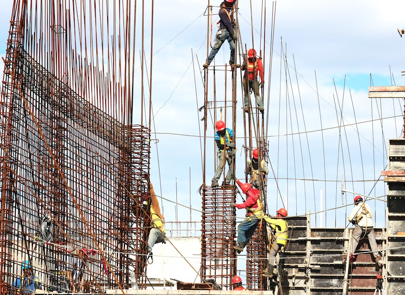 Construction workers building a concrete structure